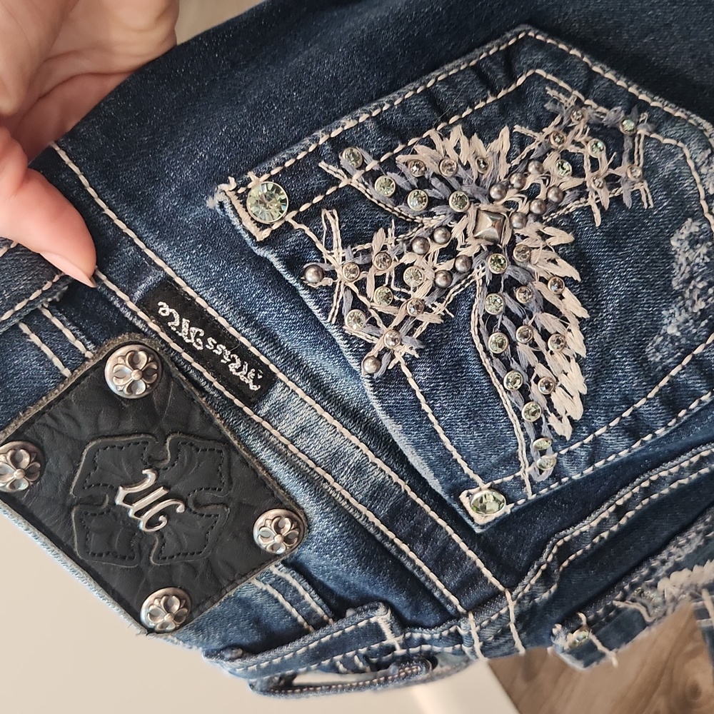 Miss Me Jean's Skinny Size 25 with Rhinestone rivets and studs.